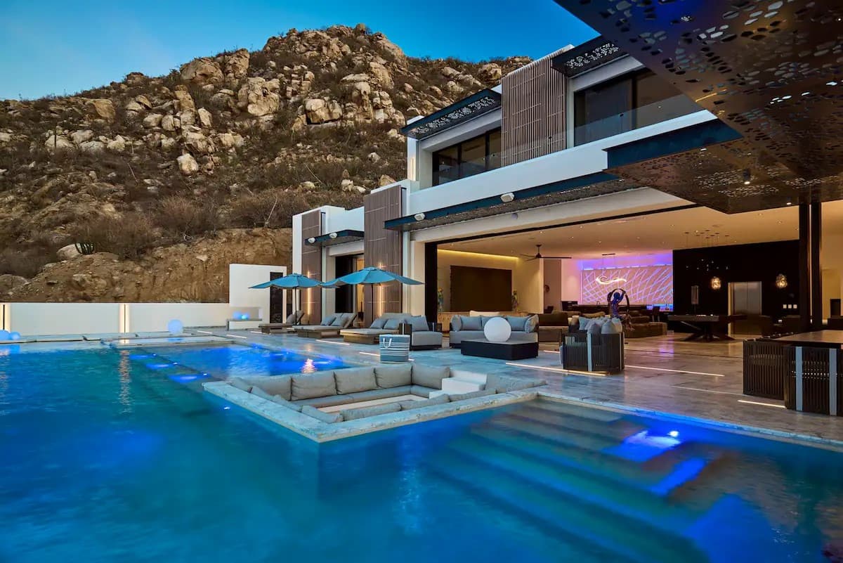 Modern villa with a pool at dusk
